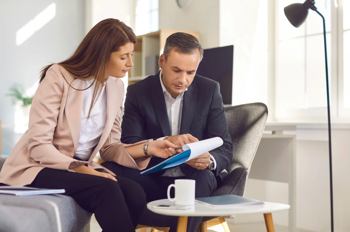 Business woman and business going over documents together